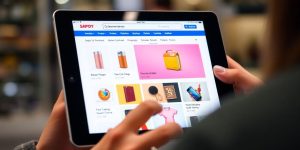 Customer browsing e-commerce site with product recommendations displayed.